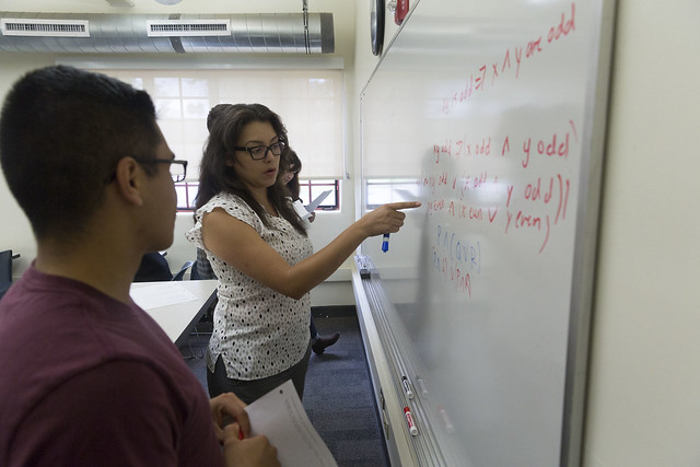 students and instructor at white board