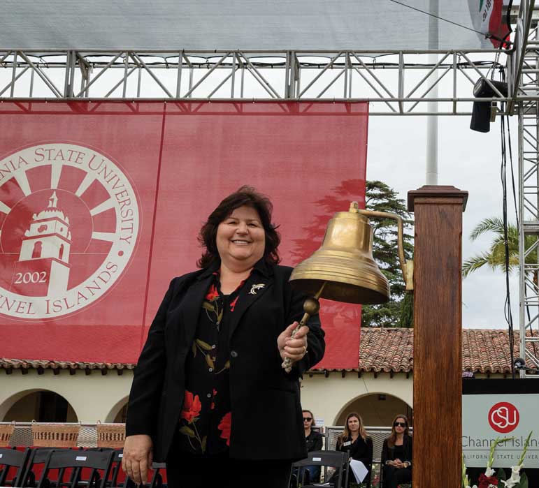 Senior Executive Director of University Communication Nancy Covarrubias Gill rang the Navy ship bell.