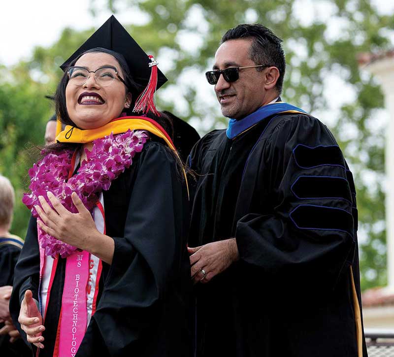 A happy graduate smiles