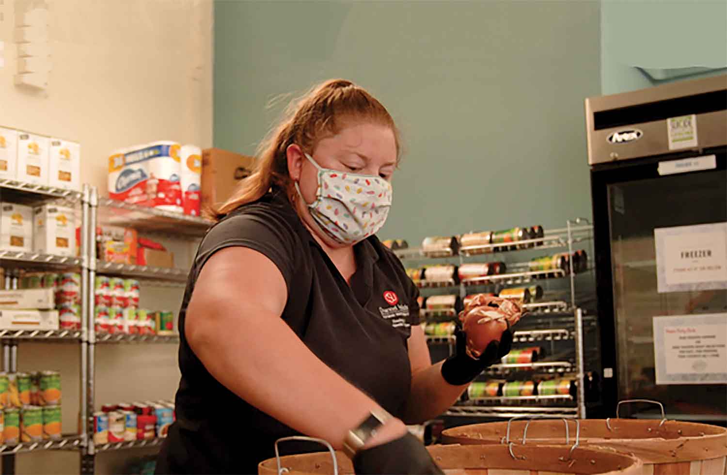 Tanya Yancheson, Coordinator of Campus Life Marketing & Repopulation Initiatives, prepares food bags. Tanya Yancheson, Coordinator of Campus Life Marketing & Repopulation Initiatives, prepares food bags.