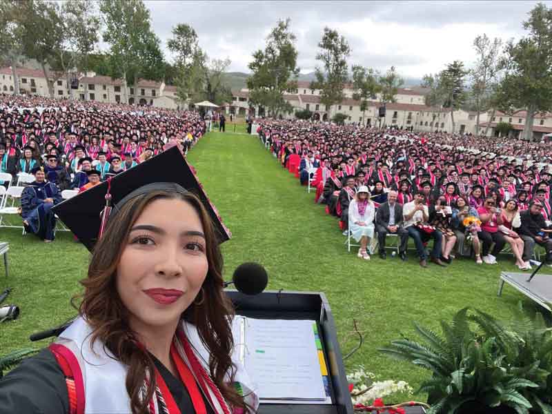 ASI Student Government President Daisy Navarette takes a selfie of the commencement audience during her afternoon speech.