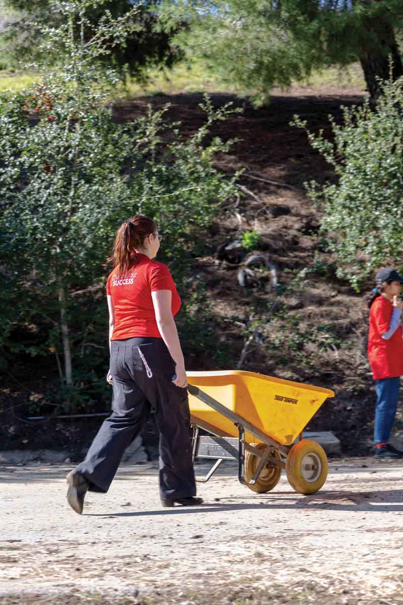 Student volunteers hauled out old hay, cleared mud from a clogged drainage channel, and spent time outdoors and with the therapy horses. Student volunteers hauled out old hay, cleared mud from a clogged drainage channel, and spent time outdoors and with the therapy horses.