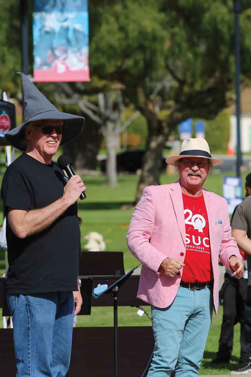 Acting Dean of the School of Arts & Sciences Phil Hampton wears his STEAM Carnival Wizard hat with Provost Mitch Avila watching. Acting Dean of the School of Arts & Sciences Phil Hampton wears his STEAM Carnival Wizard hat with Provost Mitch Avila watching.