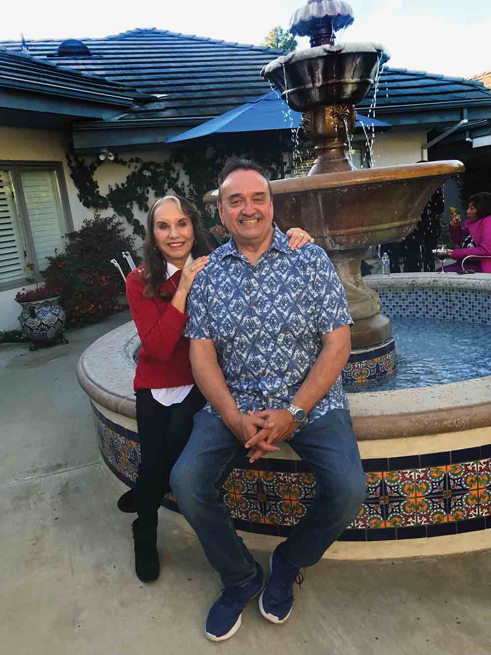 Yolanda Benitez and Dave Rodriguez sit outside their Camarillo home.