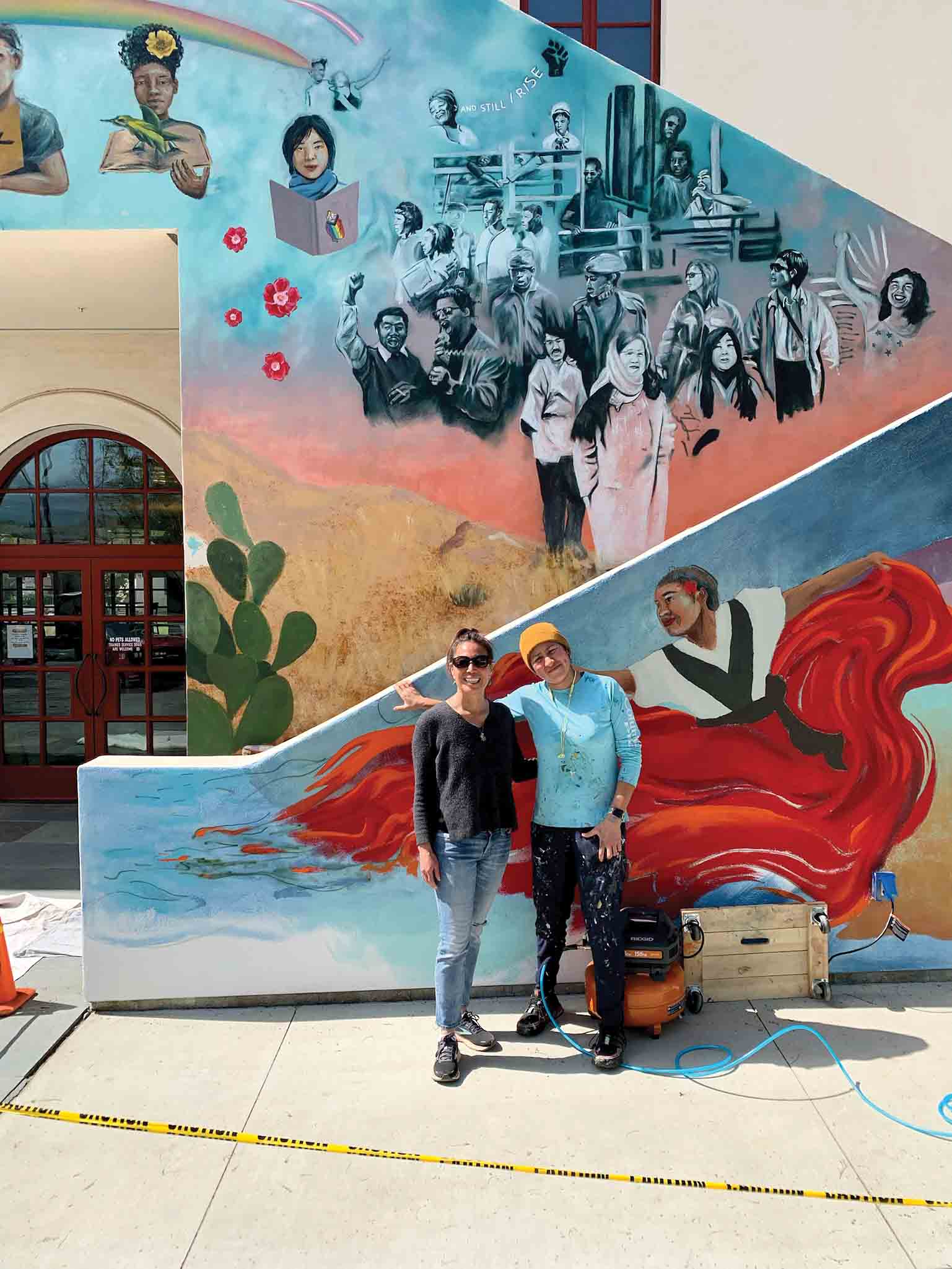 The mural was created by Los Angeles-based artist Myisha Arellano (right) shown with Christy Teranishi Martinez.