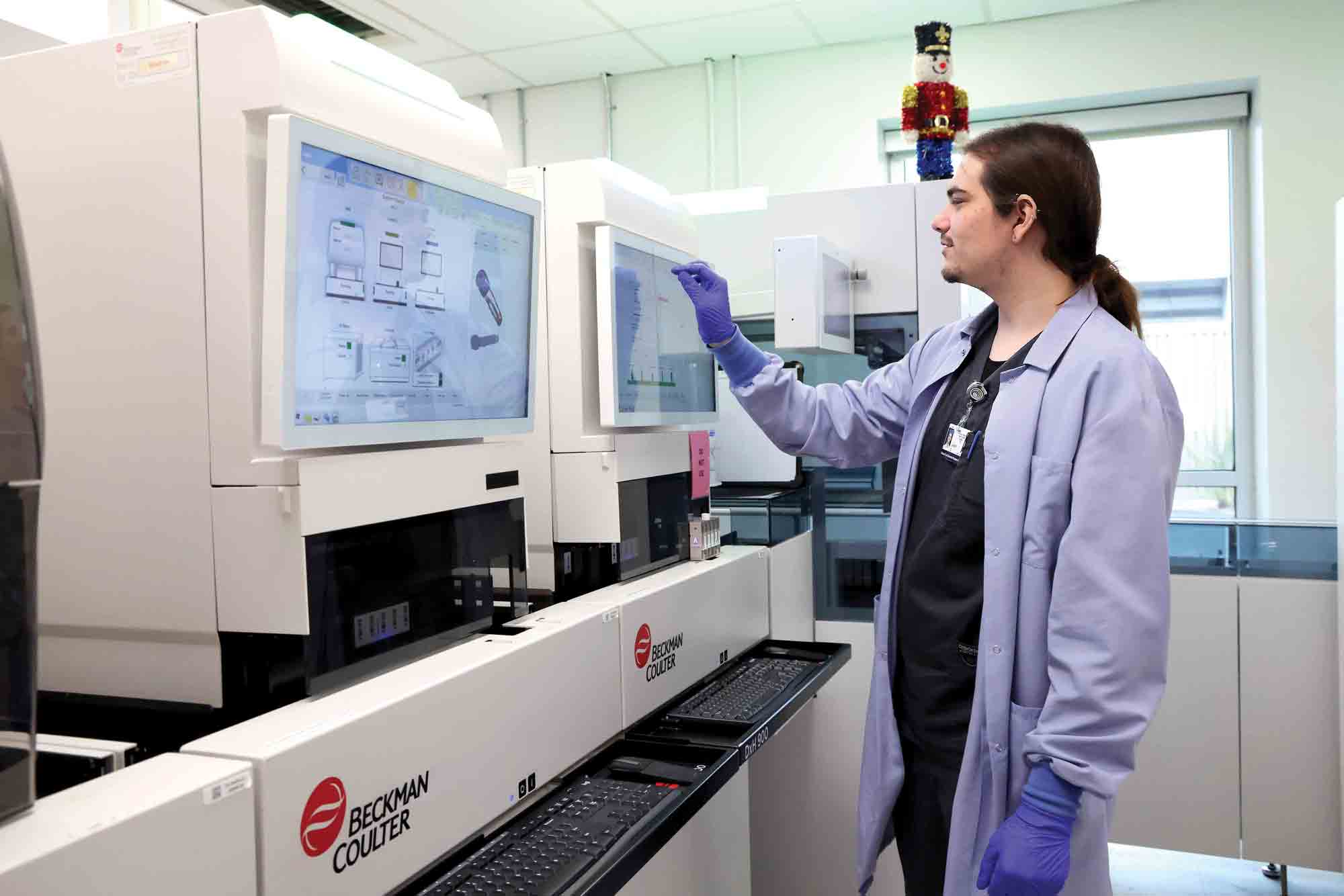 CSUCI ’24 B.S. Biology alum Jason Evans and current CLS student, works in a lab at Community Memorial Hospital.