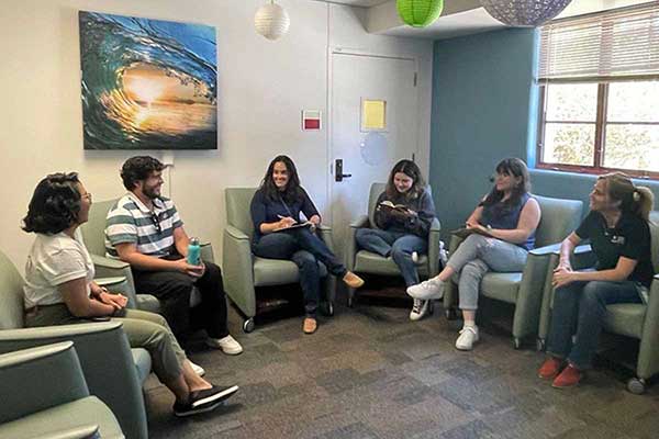 Students sitting a circle